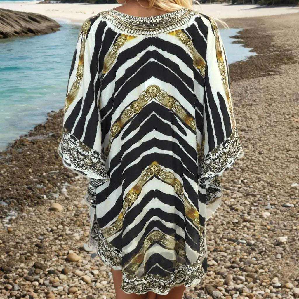 Zahara Silk Butterfly Top animal print kaftan with embellished butterfly sleeves on beach