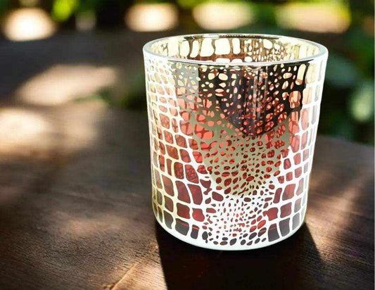 Red Gold Croc Print deluxe soy candle in decorative glass jar on wooden surface
