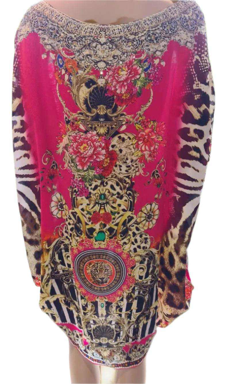 Red silk kaftan with intricate hand-embellished beadwork and vibrant animal print design