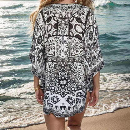 Back view of Silk Embellished Butterfly Top with geometric black and white print and beadwork by the beach