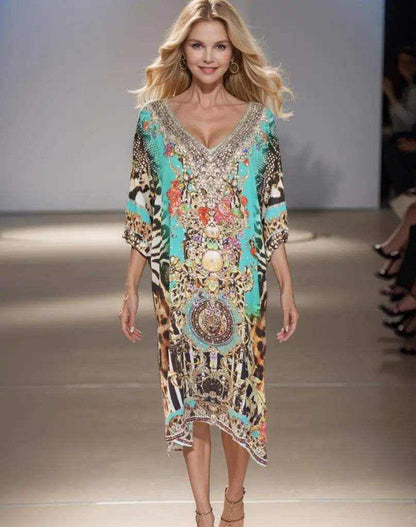 Model wearing a colorful sleeve silk embellished dress with V-neck and handsewn beadwork walking on runway
