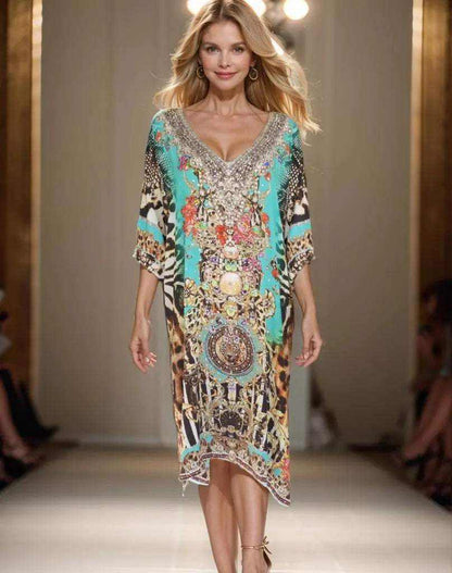 Woman wearing a knee-length sleeve silk embellished dress with V-neck and intricate beadwork in gold and silver on a colorful animal print pattern.