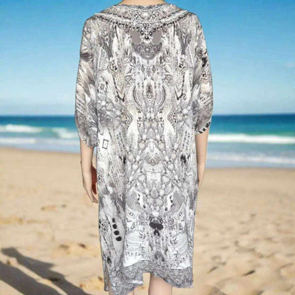 Back view of 34 sleeve silk embellished dress with intricate beadwork at the beach