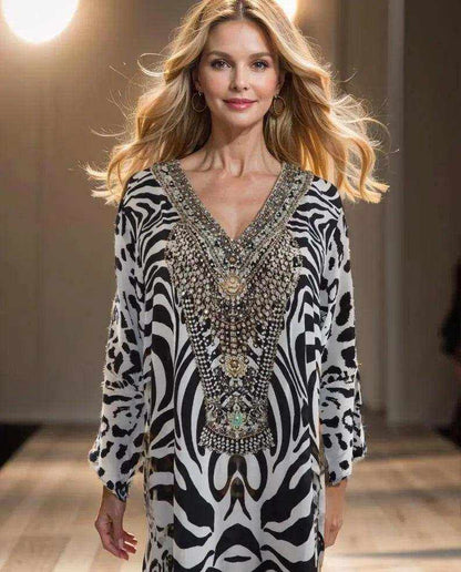Silk Hi-Low Frill Dress with black and white animal print, V-neck, long sleeves, frilled hem, and intricate beadwork embellishments.