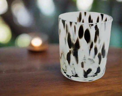 Dalmatian large glass deluxe soy candle with black and white spotted pattern on wooden surface