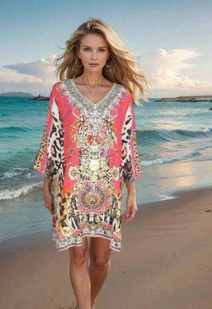 Garden Delight red silk embellished tunic dress with beadwork and animal print worn on beach