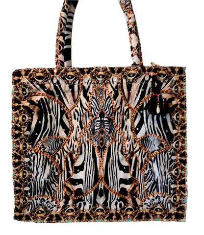 Black and white animal print tote bag with beadwork and embellishments, matching Silk Hi-Low Frill Dress accessories
