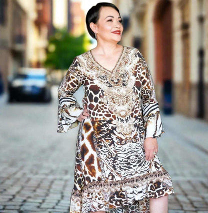 Woman wearing Silk Hi-Low Frill Dress with animal print and hand-sewn beadwork on the street