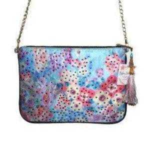 Embellished clutch with floral print, zipper enclosure, detachable gold chain, and tassel detail by Kaftans that Bling