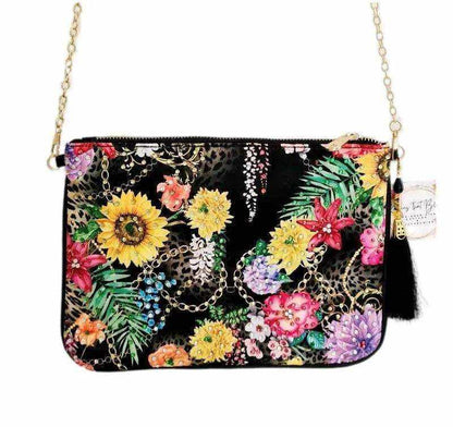 Black embellished clutch with vibrant floral print and detachable gold chain by Kaftans that Bling
