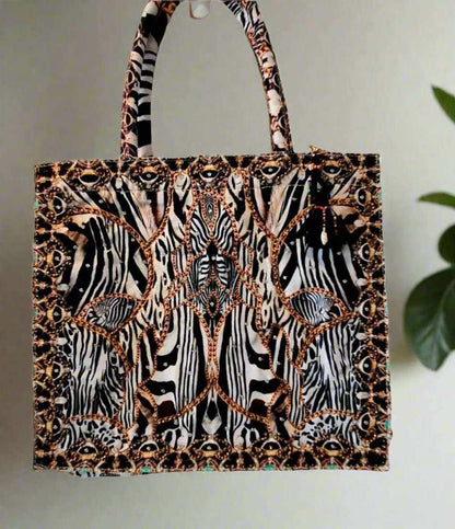 Large embellished tote bag with zebra and leopard print, padded handles, and zipper closure designed by Fashion Spectrum