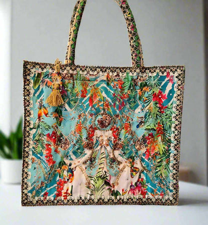 Large embellished tote bag with vibrant floral print, padded handles, and zipper closure by Fashion Spectrum
