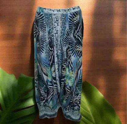 Amur silk harem pants with multicolor animal print and handsewn white and silver beadwork on ankles