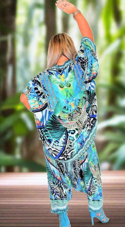 Woman wearing colorful Amur silk harem pants with intricate beadwork on ankles and matching top.