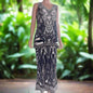 saffron black palazzo pants with wide leg silhouette and intricate beadwork on mannequin outdoors