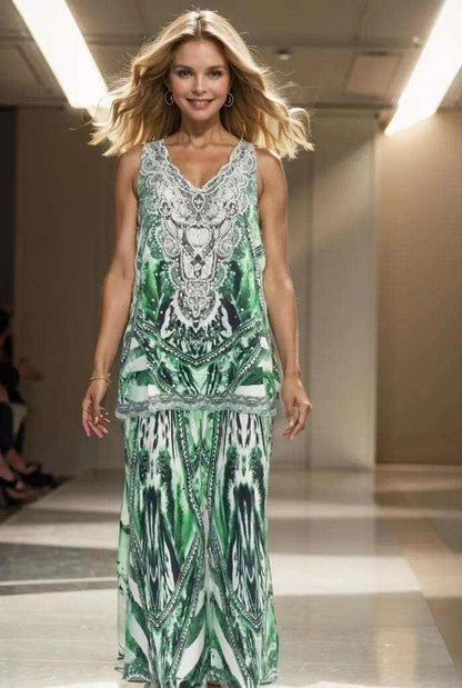 Woman wearing Saffron Green Silk Palazzo Pants with intricate white and silver beadwork and emerald black pattern