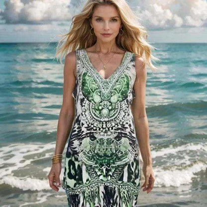 Garbo green silk cami with handsewn beadwork and animal print design worn by woman on beach
