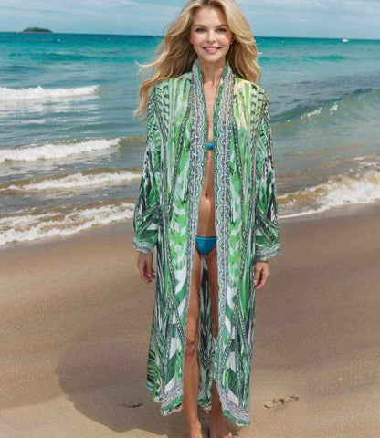 Saffron green long silk embellished jacket worn by woman on beach