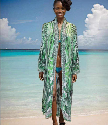 woman wearing saffron green long silk embellished jacket on beach