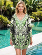 Silk Embellished Butterfly Top in Garbo Green with handsewn beadwork and butterfly sleeves modeled by woman near pool