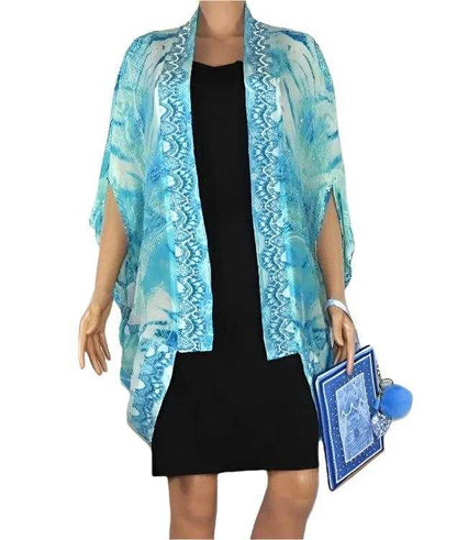 blue patterned silk cape cover-up with rounded hemline and open front over black dress