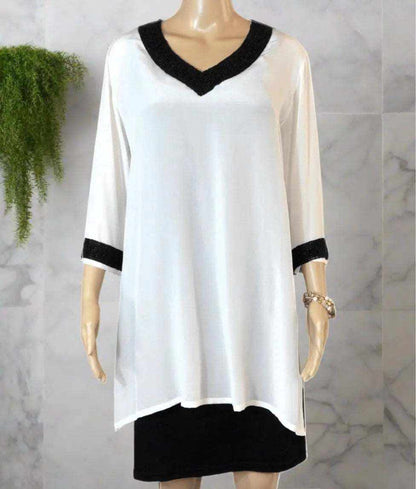 Cream silk beaded tunic top with black beaded V-neck and 3/4 sleeves by Fashion Spectrum