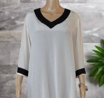 Cream Silk Beaded Tunic/Top with black beaded V-neck and 3/4 sleeves on mannequin