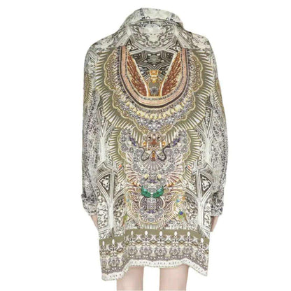 Silk button down shirt with intricate Egyptian-inspired print in soft khaki tones