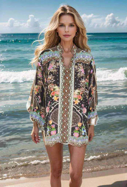 Woman wearing black floral Silk Embellished Shirt-Capri by Fashion Spectrum on the beach