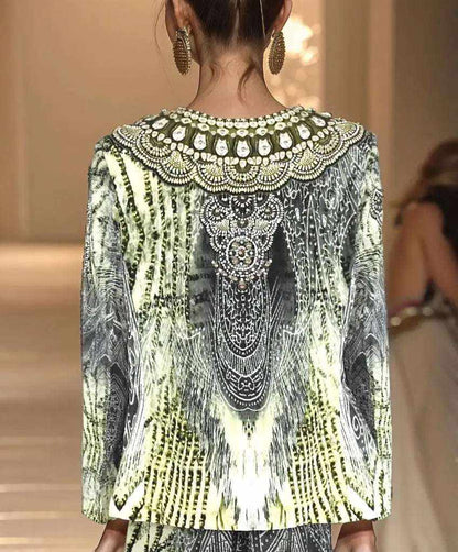 Back view of silk padded embellished jacket with intricate white and silver detailing and long sleeves